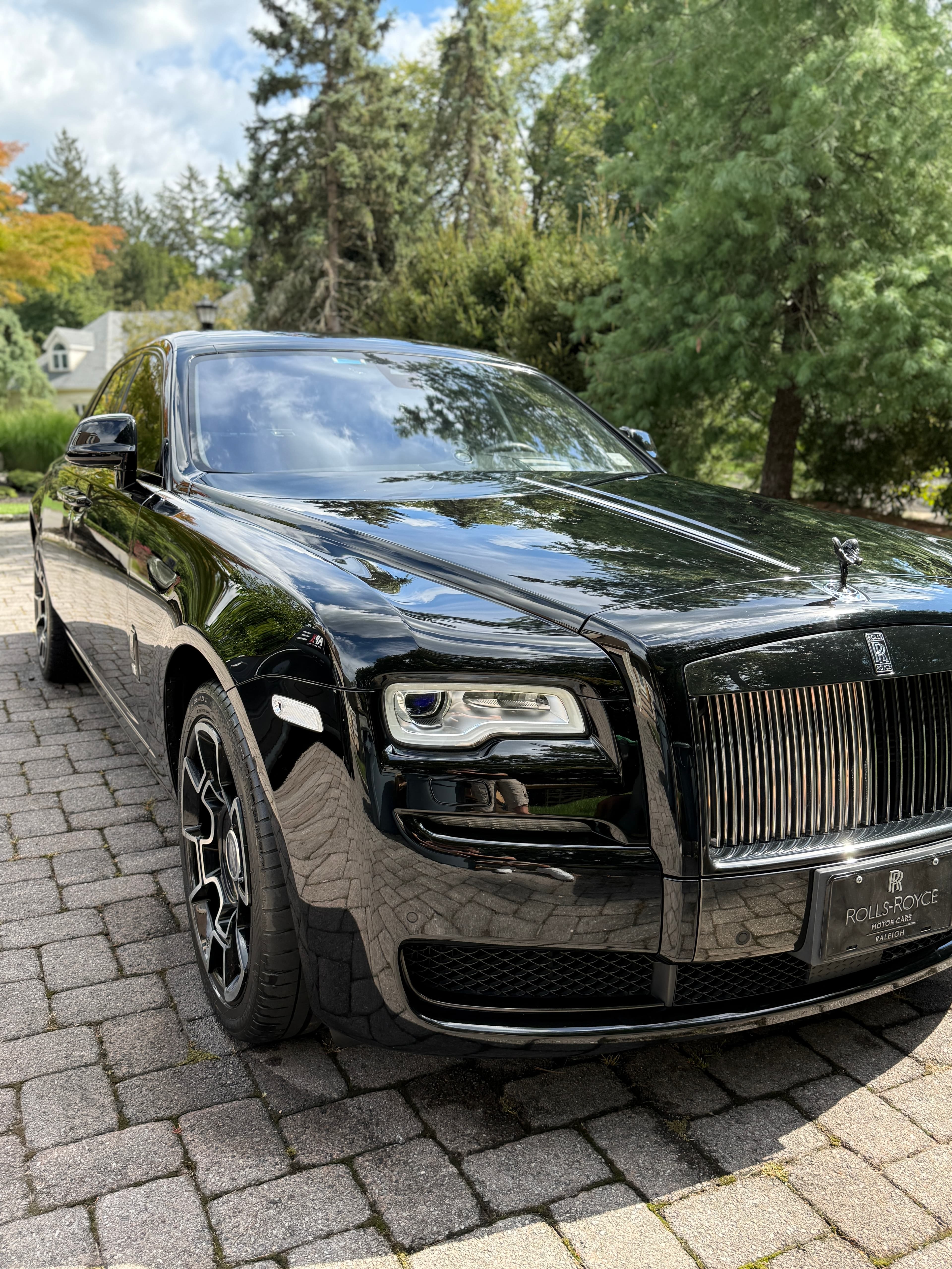 Black Rolls-Royce Ghost with a deep-gloss ceramic coated finish